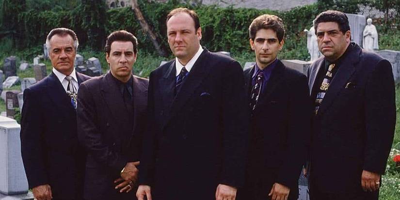 Paulie (Tony Sirico), Silvio (Steven Van Zandt), Tony Soprano (James Gandolfini), Christopher (Michael Imperioli), and Salvatore (Vincent Pastore) wearing suits during a funeral in The Sopranos