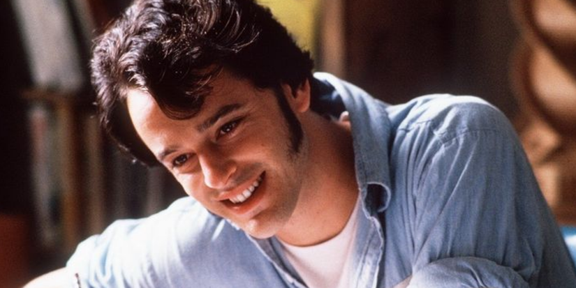 Tommy smiling in Shawshank Redemption