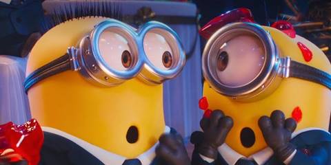 Two Minions wearing suits at an event, while looking shocked, in Despicable Me 4
