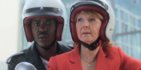 The Fifteenth Doctor and Mel Bush on a scooter wearing helmets in the Doctor Who season 14 trailer