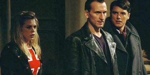 Rose, the Ninth Doctor, and Jack looking scared as they're surrounded by gas mask zombies in the Doctor Who episode 