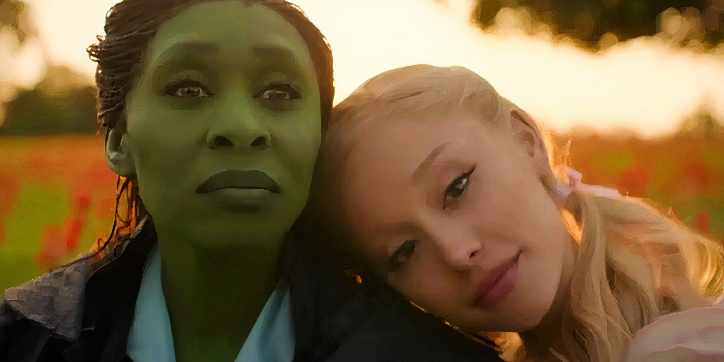 Glinda sitting with her head on Elphaba's shoulder in Wicked