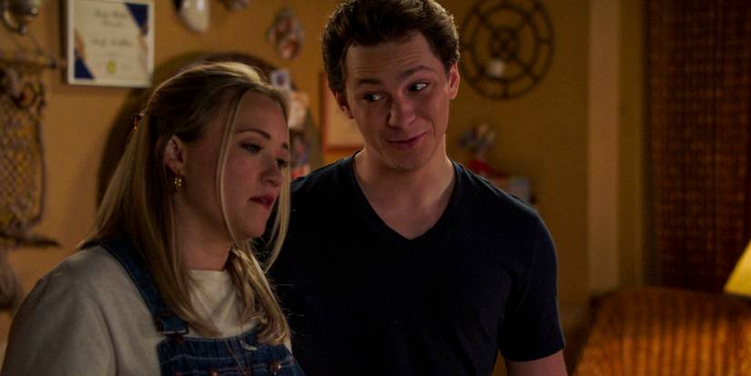 George looks at Mandy insistently, trying to convince her of something in Young Sheldon season 7 ep 10