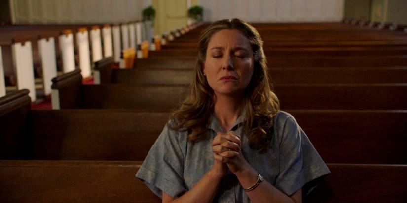 Mary Cooper (Zoe Perry) praying alone in the church in Young Sheldon season 7  episode 13