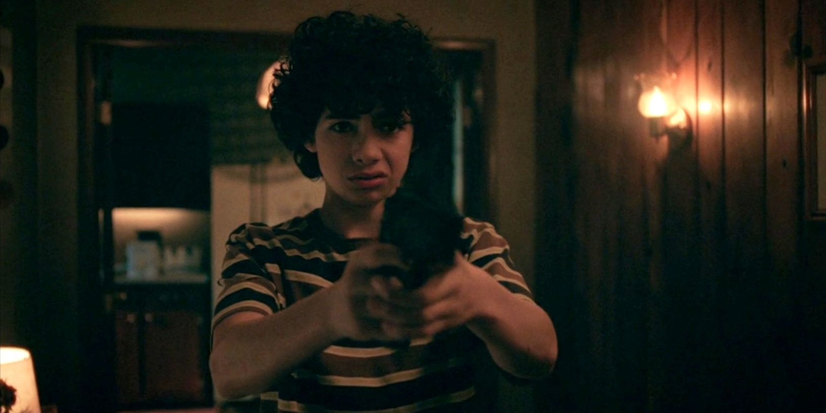 Young Will holding up a gun in Will Trent season 2, episode 8