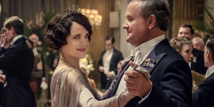 Cora and Robert dancing in the first Downton Abbey movie, with Cora smiling at someone in the distance