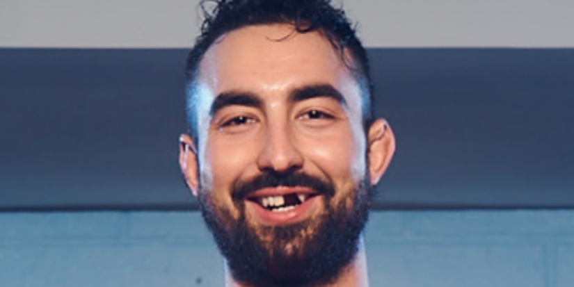 Andrew Antsanen smiling with a missing tooth in Shoresy (1)