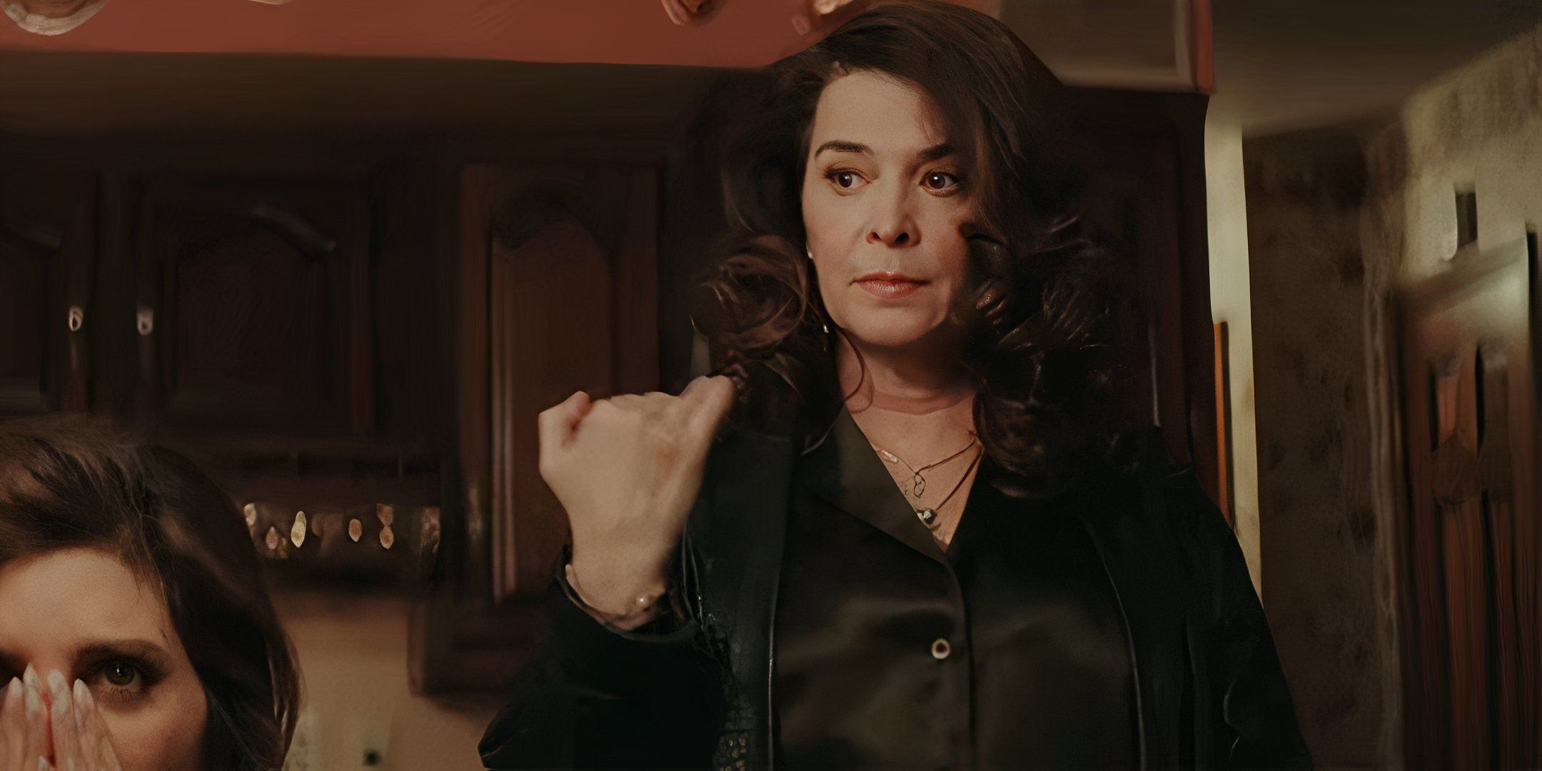 Annabella Sciorra as Christine looking upset and making a cut off motion with her hand in Fresh Kills