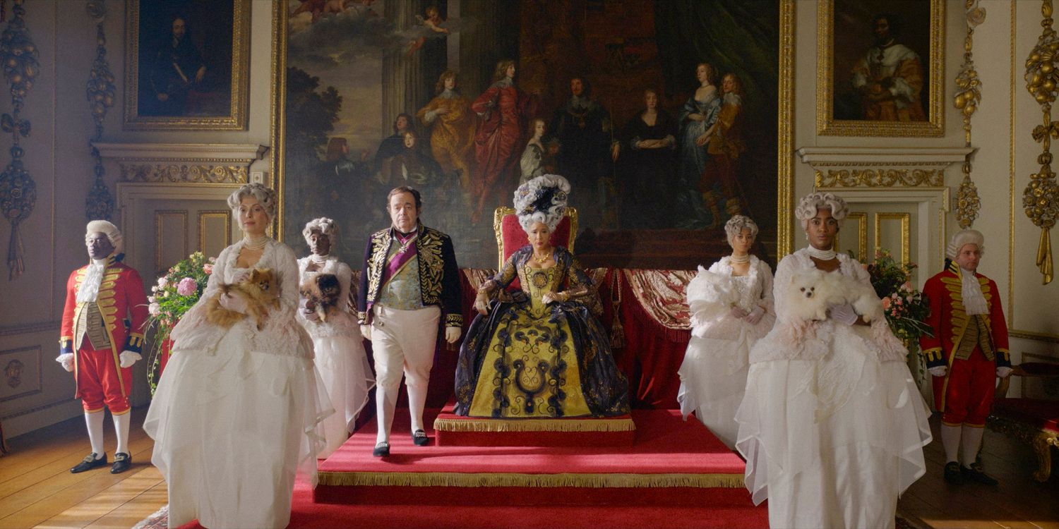 Queen Charlotte (Golda Rosheuvel) seated on her throne, accompanied by her court in Bridgerton season 3 episode 6