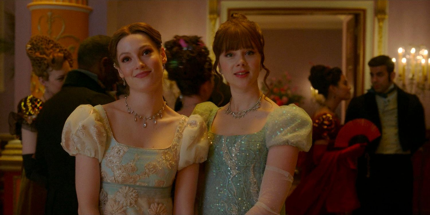 Francesca Bridgerton (Hannah Dodd) and Eloise Bridgerton (Claudia Jessie) smiling at the Dankworth-Finch ball in Bridgerton season 3 episode 8