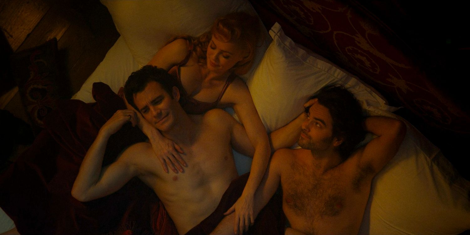 Lady Tilley Arnold (Hannah New), Benedict Bridgerton (Luke Thompson), and Paul (Lucas Aurelio) lying in bed after sharing an intimate moment in Bridgerton season 3 episode 8