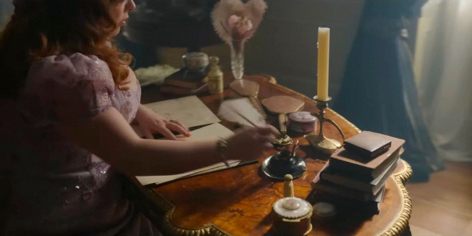 Penelope (Nicola Coughlan) at her desk writing Lady Whistledown's Society Papers in Bridgerton season 3 Part 2