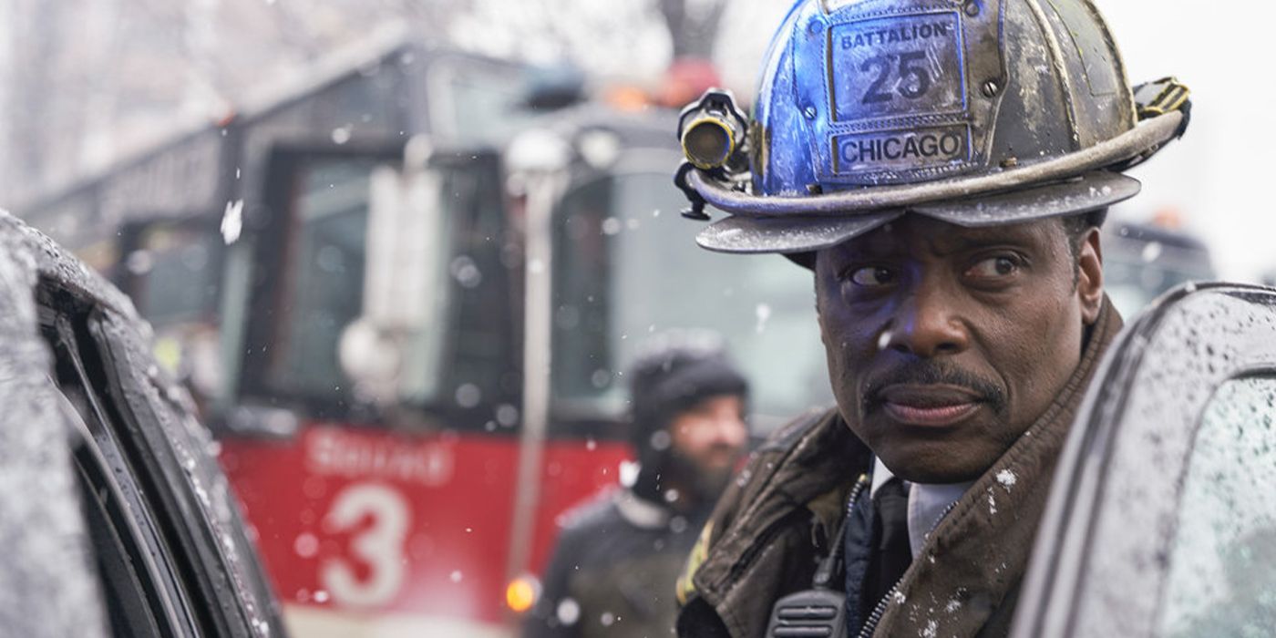 Boden stands in the rain in his full firefighting gear in Chicago Fire