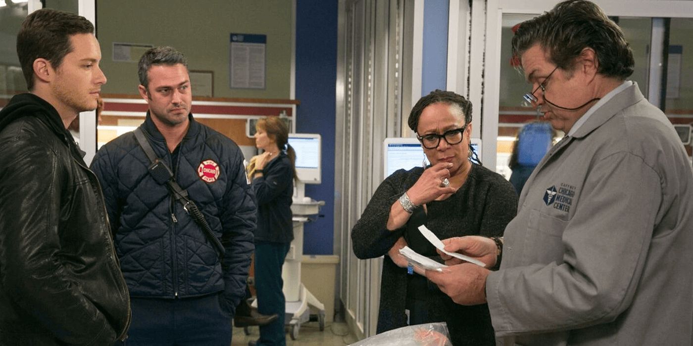 Dr. Charles and Sharon Goodwin look at documents while talking with Severide in Chicago Med