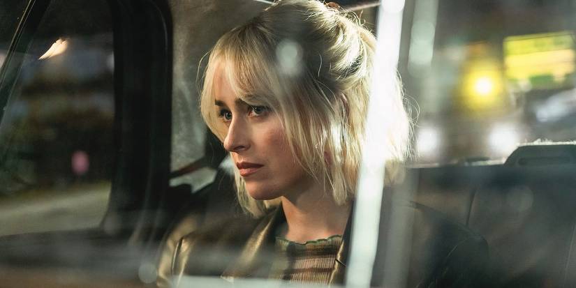 Dakota Johnson sitting in the back of a cab in Daddio