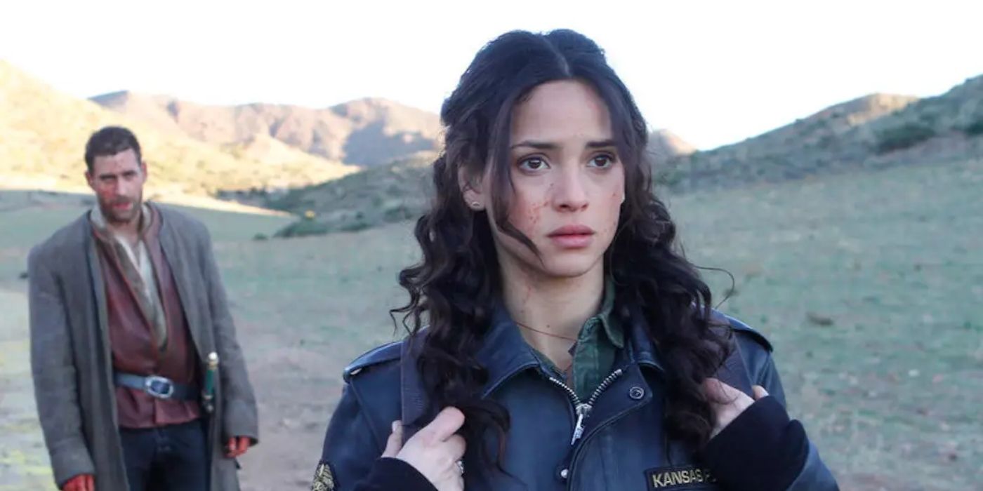 Adria Arjona looking concerned in Emerald City