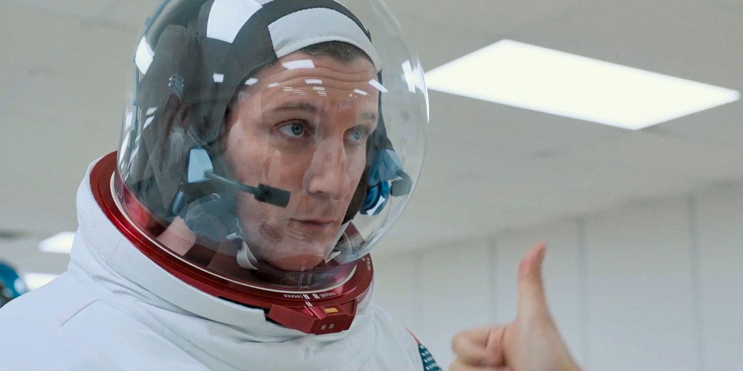 An actor in an astronaut suit receiving a thumbs up in Fly Me to the Moon