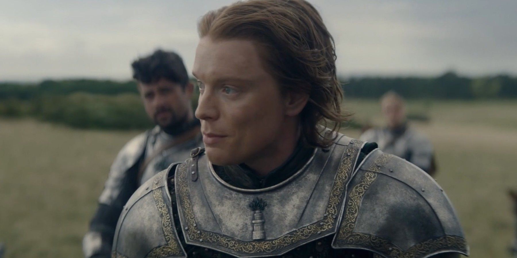 Freddie Fox as Ser Gwayne Tower in armor looking to the left of the screen in House of the Dragon season 2