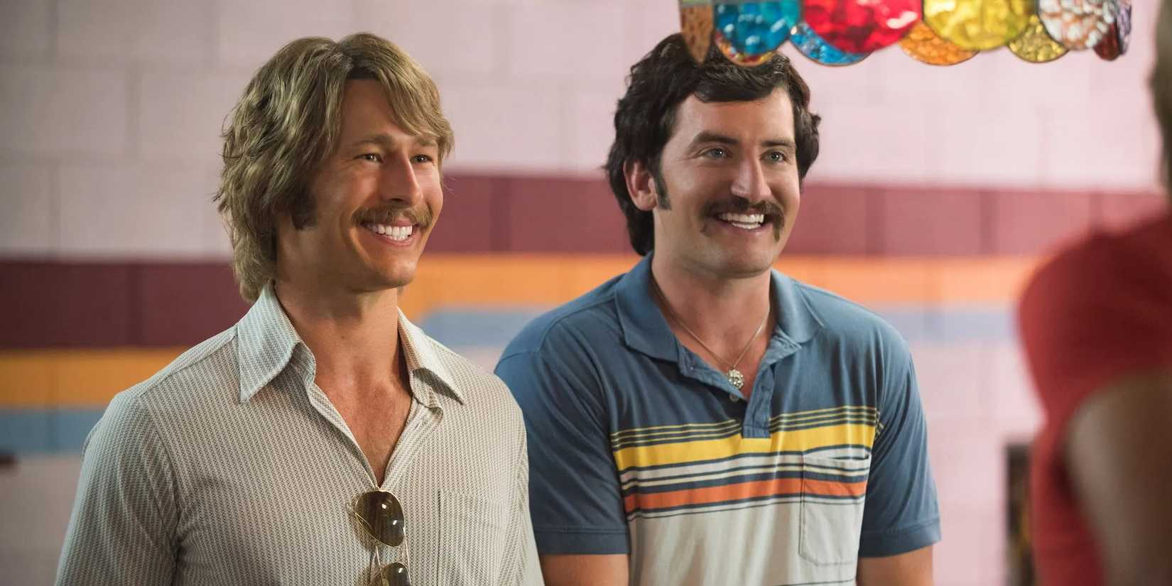 Glen Powell as Finn and Forrest Vickery as Coma smiling in Everybody Wants Some