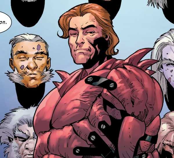 Graydon Creed standing in front of a wall with Sabretooth heads mounted on it.