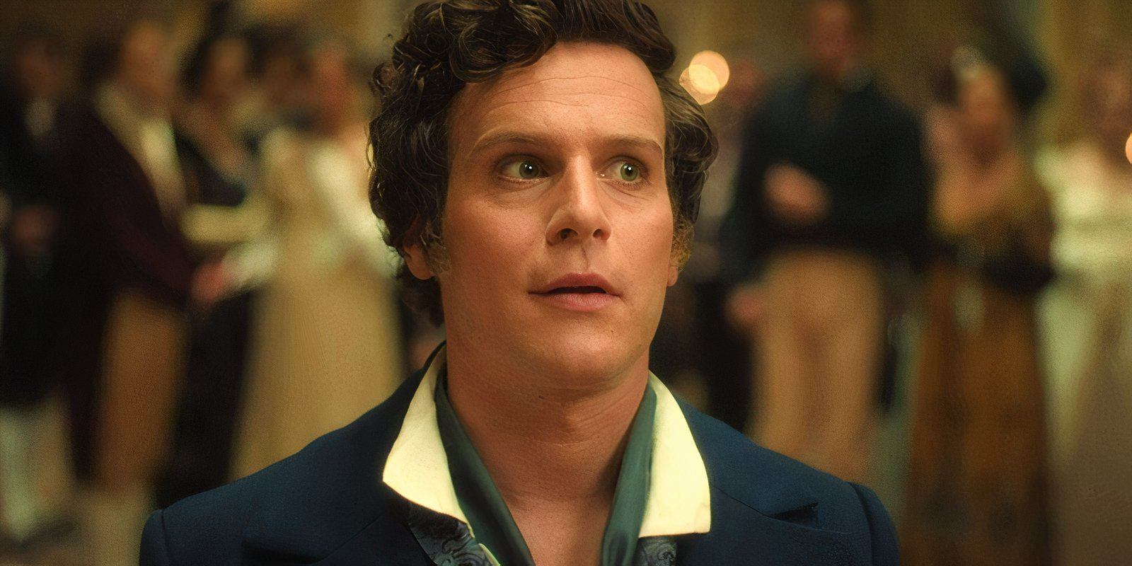 Jonathan Groff as Rogue looking confused in the middle of the ballroom in Doctor Who