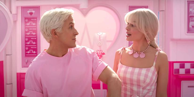 Ken and Barbie look at each other in Barbie.