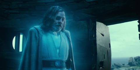 Luke Skywalker's (Mark Hamill) Force ghost stands in front of a door while speaking to Rey in the Rise of Skywalker