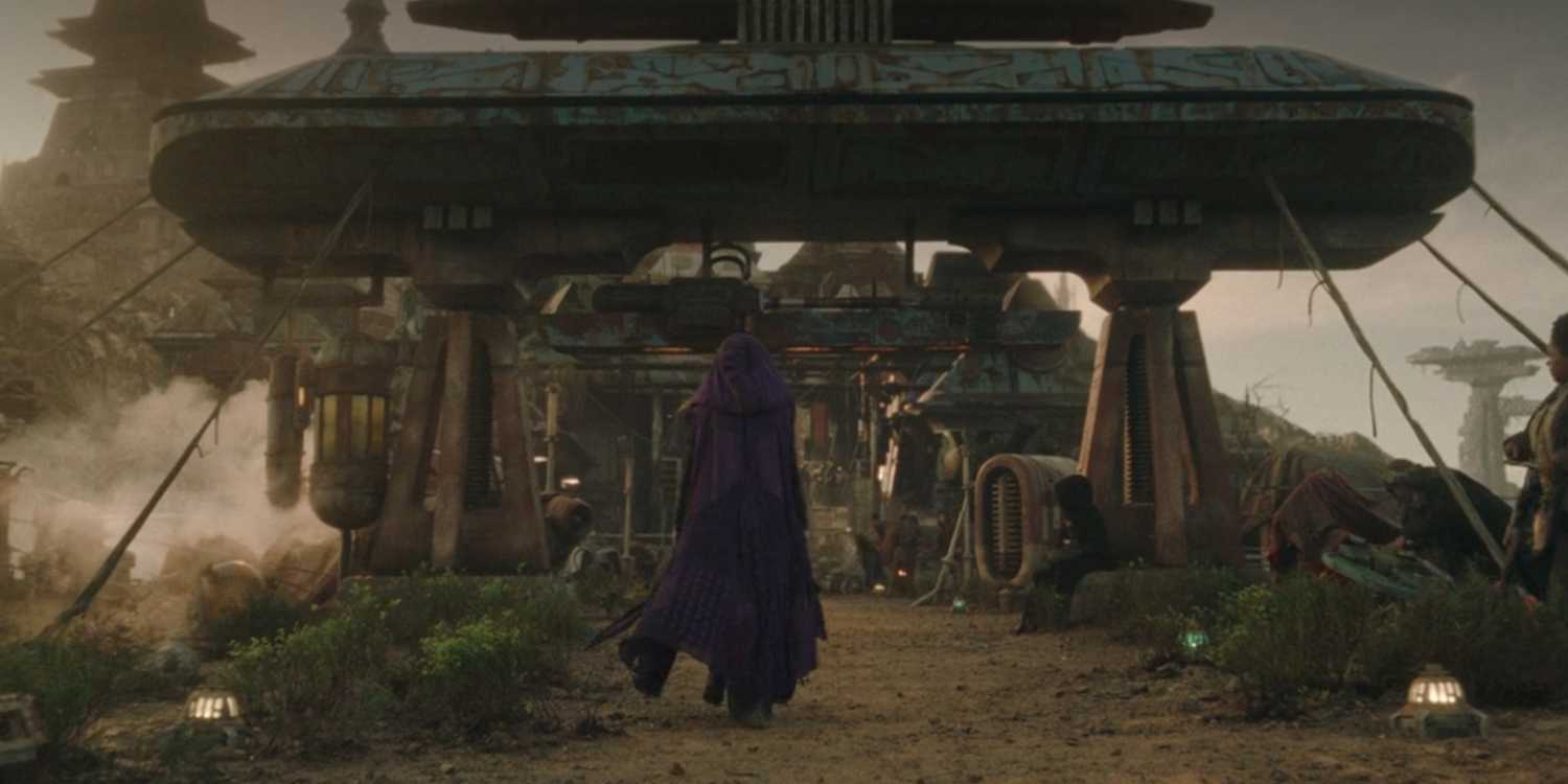 Mae walking in her hooded cape on Ueda