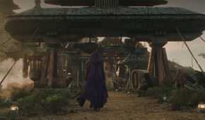 Mae walking in her hooded cape on Ueda