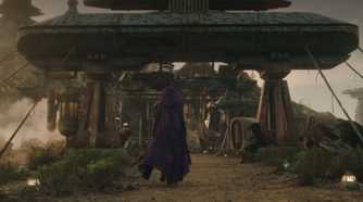 Mae walking in her hooded cape on Ueda