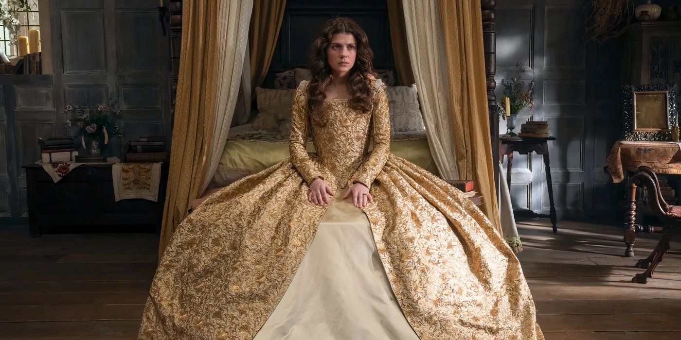 Jane sits sadly in a massive gold and white dress in My Lady Jane