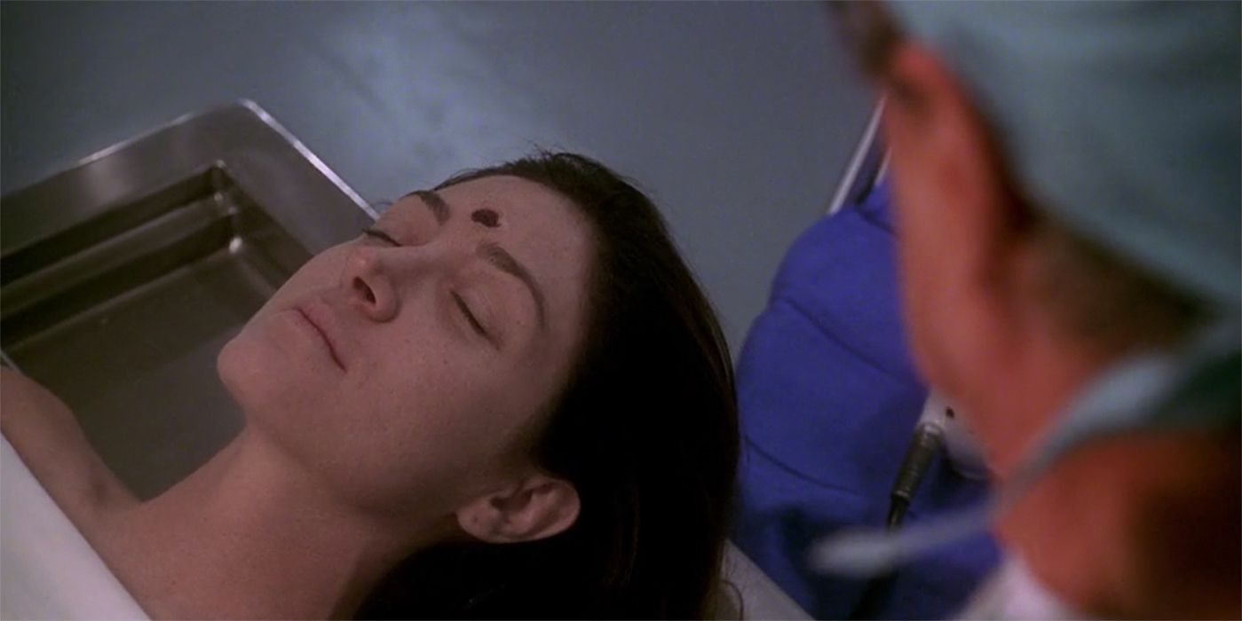 A close up of Kate Todd with a bullet wound in her forehead in autopsy in NCIS