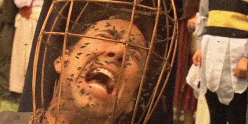 Nicolas Cage screaming as a basket of bees covers his head in The Wicker Man Cropped copy