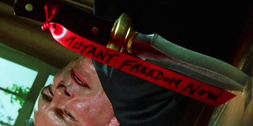 The Greatest Opening Scene In Superhero Movie History Remains Undisputed 1 Nightcrawler's Mutant Freedom Now sign at the start of X2 X-Men United