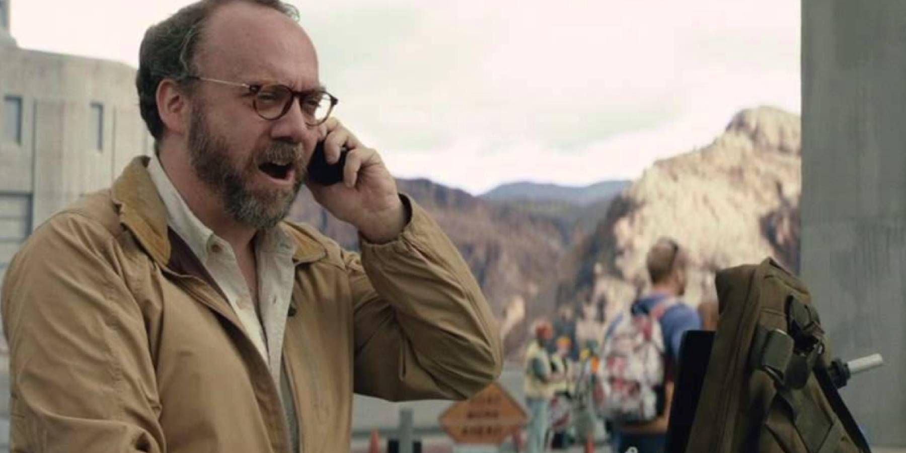 Paul Giamatti on the phone near a construction site in San Andreas