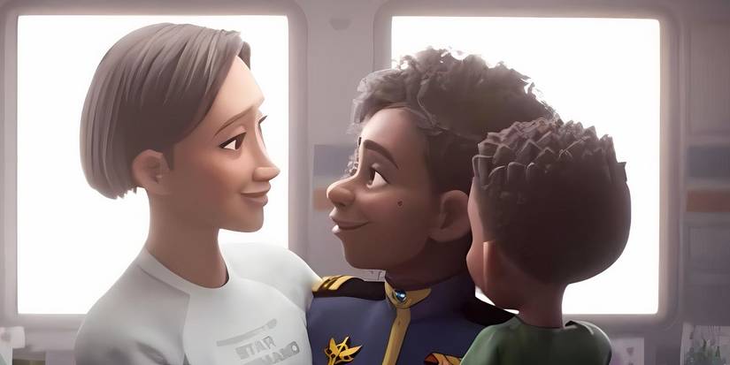 Alisha e Kiko sorridenti insieme al loro bambino