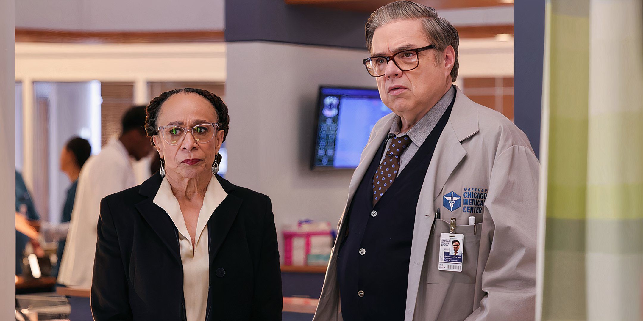 S. Epatha Merkerson as Sharon and Oliver Platt as Dr. Charles looking worried in Chicago Med season 9