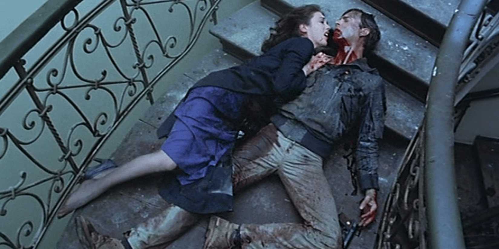 Sam Neill and Isabelle Adjani lying on a staircase in Possession
