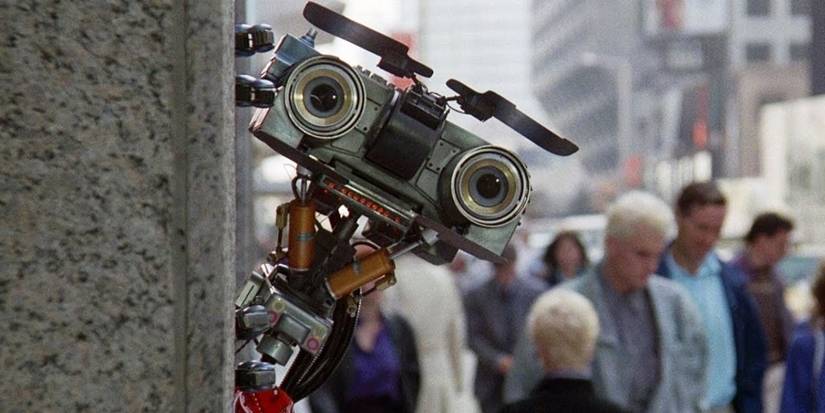 The robot Johnny 5 peering around a corner in a busy street in Short Circuit.