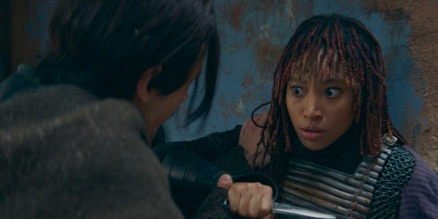 Qimir threatening Mae (Amandla Stenberg) with a dagger in The Acolyte Season 1 episode 2