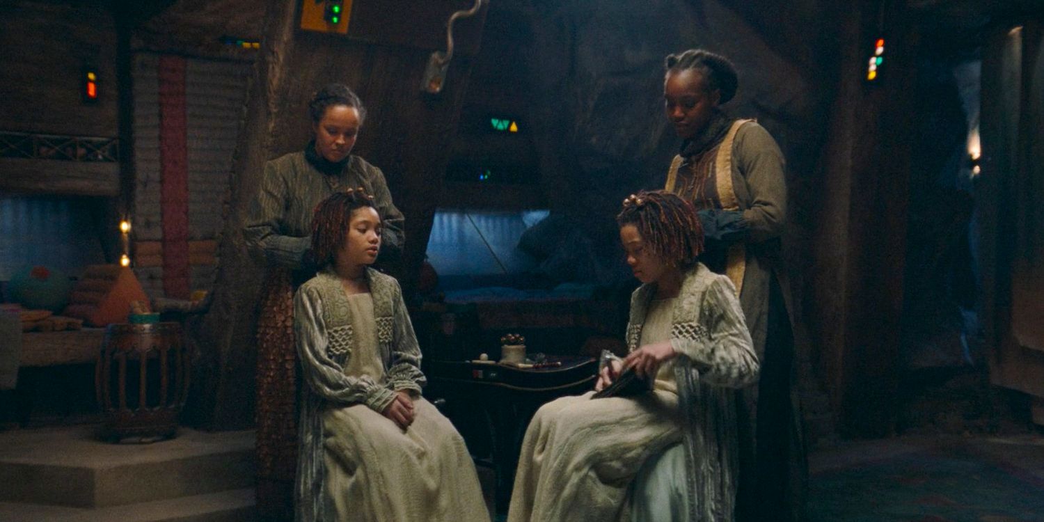 Little Osha (Lauren Brady) and Little Mae (Leah Brady) being prepared for the Ascension Ceremony in The Acolyte season 1 episode 3