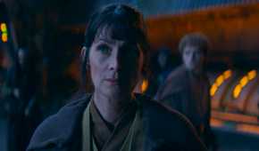 Young Indara (Carrie-Anne Moss) standing in the witches' fortress in The Acolyte season 1 episode 3