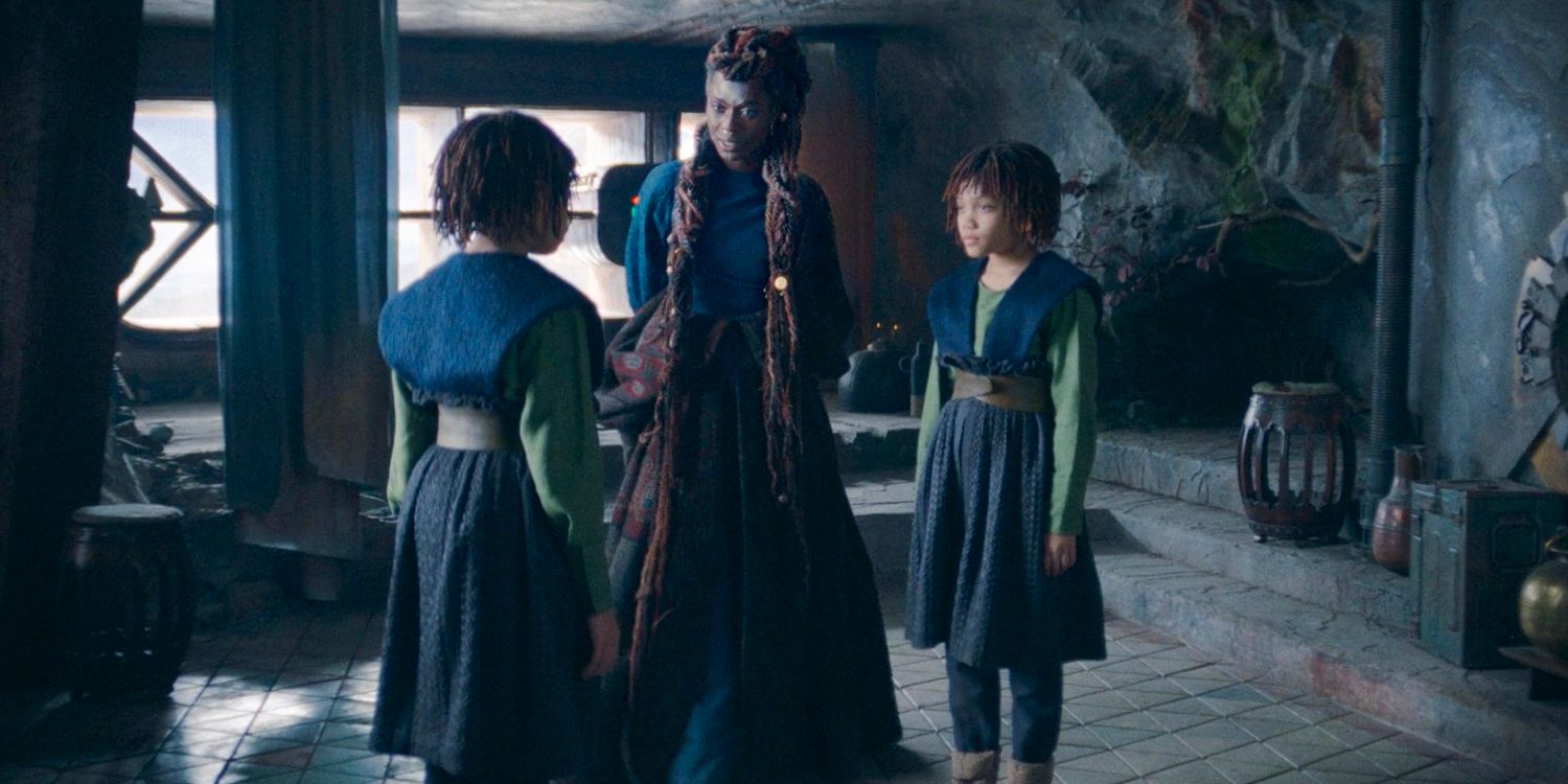 Mother Aniseya (Jodie Turner-Smith) talking with Little Mae (Leah Brady) and Little Osha (Lauren Brady) about her meeting with the Jedi in The Acolyte season 1 episode 3