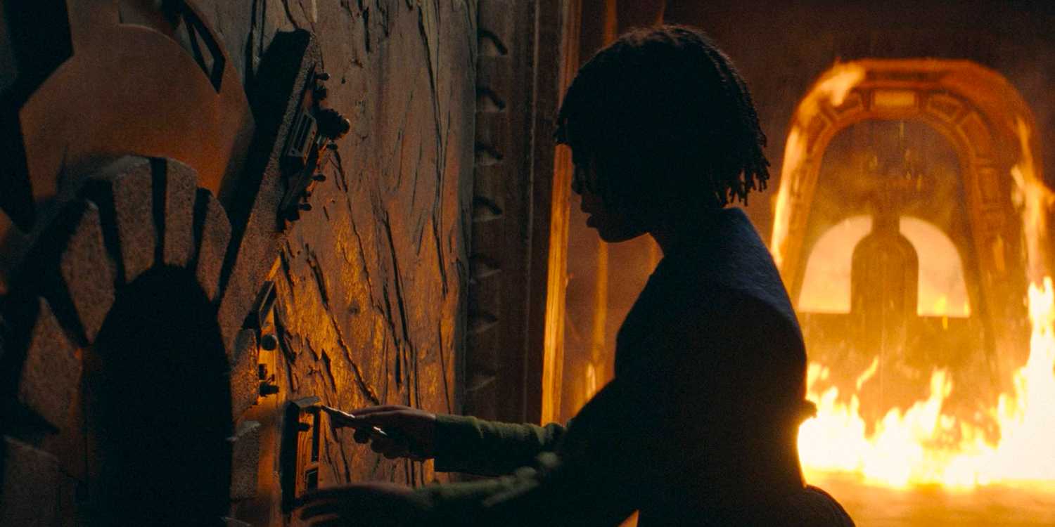 Little Osha (Lauren Brady) trying to escape her room as it catches fire in The Acolyte season 1 episode 3