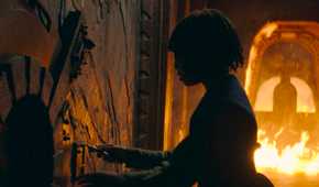 Little Osha (Lauren Brady) trying to escape her room as it catches fire in The Acolyte season 1 episode 3