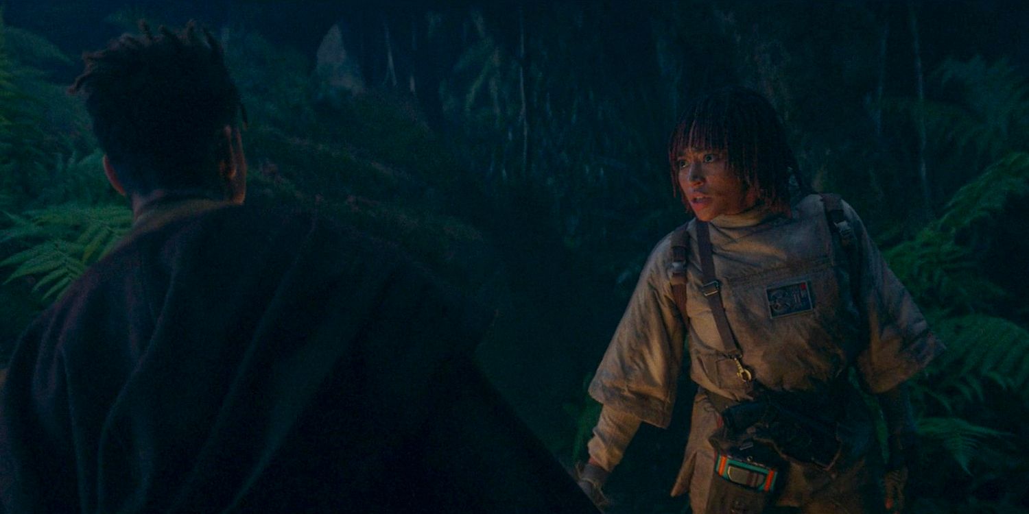 Yord Fandar and Osha (Amandla Stenberg) walking in the depths of a dark forest in Khofar in The Acolyte season 1 episode 5