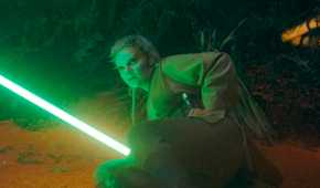 Jecki Lon (Dafne Keen) holding her lightsaber while lying on the ground in The Acolyte season 1 episode 5