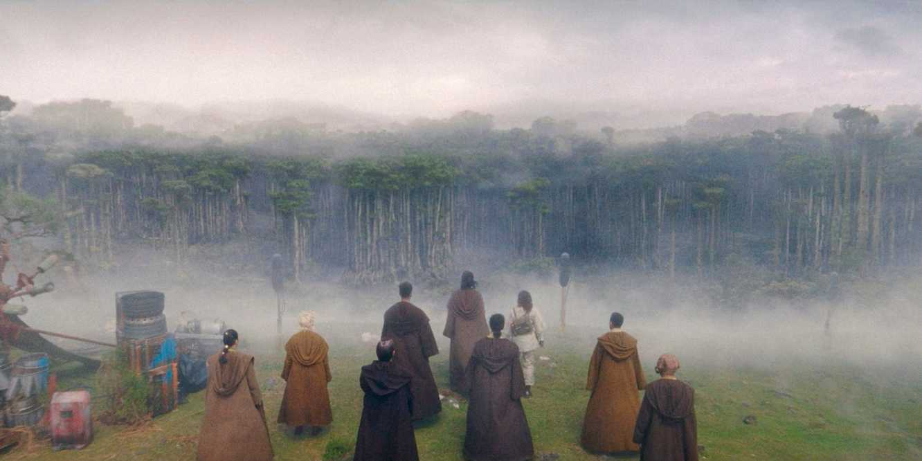 Master Sol and all the Jedi on the mission looking towards the dense and misty forest in Khofar in The Acolyte season 1 episode 4