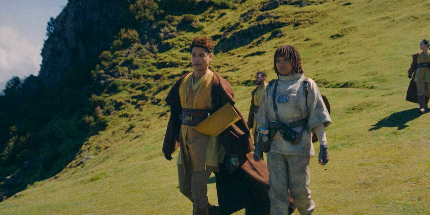 Yord Fandar (Charlie Barnett) and Osha (Amandla Stenberg) talking as they walk through the hills of Khofar in The Acolyte season 1 episode 4