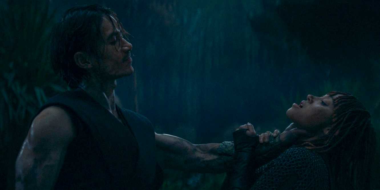 Qimir/Sith (Manny Jacinto) strangling Mae (Amandla Stenberg) for betraying him in The Acolyte season 1 episode 5
